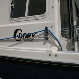 Sea Angel Port Cam Cleats- 1/2" gold 25' braid bow line thru bottom cam cleat, 3/8" blue 25' breast line through top cam cleat