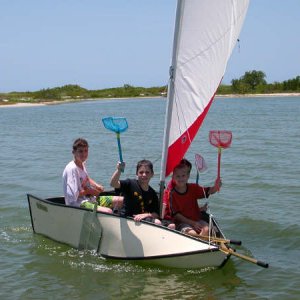 Pirates in training!!! Good shot of our fold up dingy. There are 4 kids 
aboard.