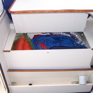 Table can be stowed high enough over bench seat to allow access to foot and  bench seat lockers.