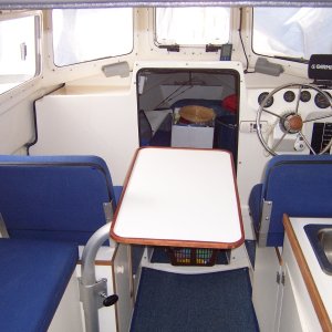 Table can also be positioned between the helm and passenger seat.