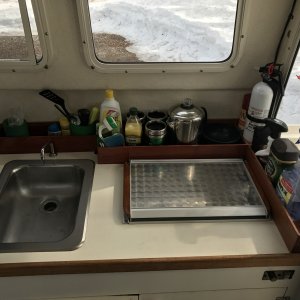 Media 'Wood storage racks on galley counter top' in album 'C-Swell did not have a table so I decided to add a Garelick stowable table. I added cherry wood molding made by my Dad to keep things from sliding off and to go with the other wood trim in the cabin.'