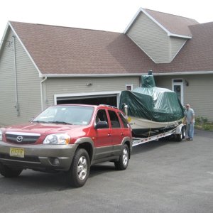 My Mazda Tribute, which is also a Ford Escape pulls the boat with ease. I have the V6 3.0L, AWD and towing package. I also make sure to change the fluids according to heavy use plan.
