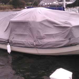Angola Canvas Cover in 30 mph wind requiring hull line to tie it down.