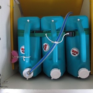 Temporary/modular water tank setup, overview.  Three 6-gallon Reliance brand water jugs - can be found at Wal-Mart, camping shops, etc.