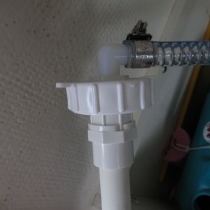 The large ring is the one that comes with the water jug (as is the flat cap I drilled).  I just made one of these and can move it from tank to tank.  I plan to fill the tanks in place.  The hose is the one that runs normally to the foot pump; I just left it extra long when I replaced it.  I'll cut it down to size when I put in the new/permanent water tank.  More info in "Sunbeam ~ 22 Cruiser" thread.