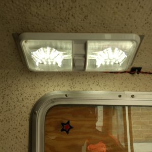 Media 'Our old '89 only has a light above the cockpit door and in the v-berth. Both have been changed to red LED since they don't attract bugs. Added this one above the galley for the times we need real light. It's only stuck up there with 3M tape until I'm sure that's where it's going to stay.' in album '3 LED pods for inside the gallery cabinet'