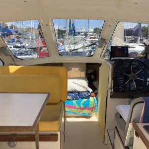 dinette / helm/ full queen bed with storage below