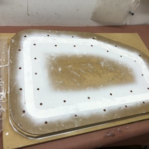 Mold has been filled with fiberglass and West System 105 epoxy resin with white color additive. I waited three days then I sanded the excess cured resin from the top of the mold before disasssembling the mold and releasing the part. I was nervous about it releasing but it easily popped free.