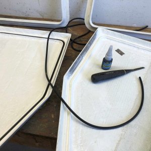 Here the o-ring material is being inserted (friction fit) into the channel. The o-ring material is .250" Buna-N 70 O-Ring Cord Stock, from theoringstore.com. The glue is Vibra-Tite 388 Super Glue (specifically for gluing rubber) from Amazon. I used the chisel to make clean out the channel and ensure it was fit to hold the o-ring. The reinforced area (extra later of fiberglass) alongside the long side of the lid is where two latches will be installed. Next up - build the lockers!