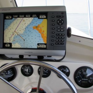 Cruising in calm conditions with two adults, full fuel, 17 inch prop at 4800 RPM yields about 18 knots.  Top speed 24.  We are off course per Range Boat instructions to avoid Dahlgren firing.