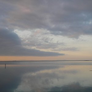 Water colors across Sequim Bay north toward the San Juans