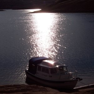 Early morning sun reflecting on water and S