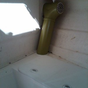 starboard side V-berth exposed ductwork with another strainer