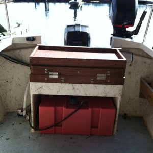 Media 'Looking aft, the fuel tank has a 27 gal capacity. Above that is a cutting board/table that folds out of the way for access to the batteries, battery switch and the motors.' in album 'Tied up at the public dock in Port Orchard.'