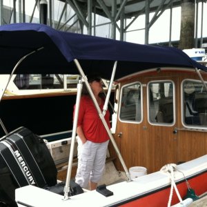 The custom bimini top (with stainless steel bows) is brand new (July 2012).