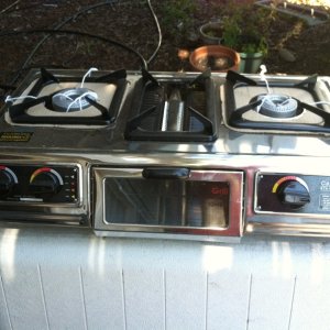 Prior to deciding to sell our C-Dory, we had considered re-building the cabinets and installing this propane stove. It will go with the boat at the buyer's discretion.