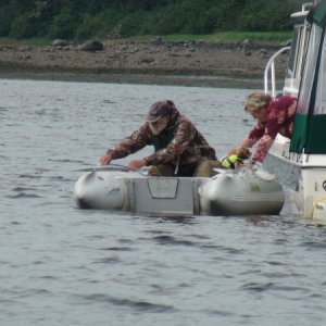 Brent taking Rusty to shore-Portage Bay