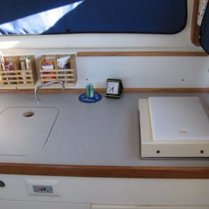 galley rework, removed Origo stove, backfilled  opening with plywood,installed forward facing one burner Wallas