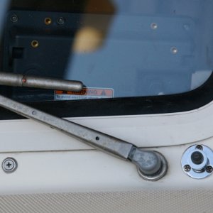 Starboard-Washer Nozzle Mounted in a small 3/8" cable mount fitting. The port nozzle is identical.