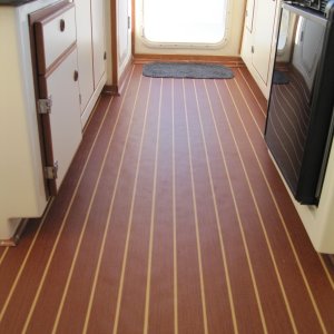 New teak laminate flooring installed by the folks at Wefings.  Really attractive and nicely finished