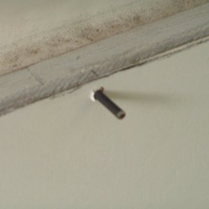 Drywall screw inserted, then end cut off and rounded