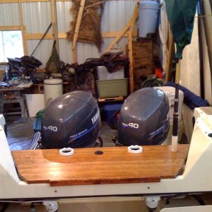 Board in back with cup holders, rod holder and net holder