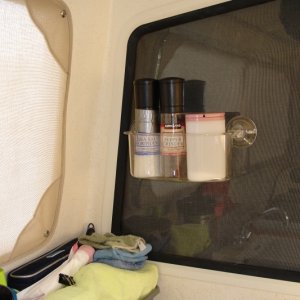 Bed Bath & Beyond suction rack. Sticks to glass or cabinets.