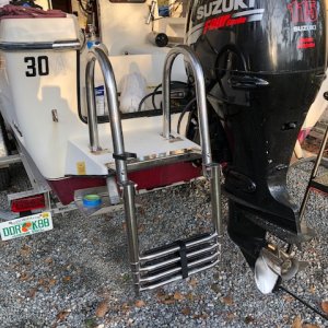 Amazing 4 step ladder for about $150 ordered online.
The rails make a huge diffence in getting a fully geared heavy diver on board.