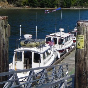 Media 'JC Lately and SleepyC at SBSP dock, mid low tide.' in album 'Sure a good thing the tide is headed homeward too, or he wouldn't be making much progress.  Beautiful Blue.'