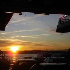 Media 'Sunset over the Olympic mountains from the Kingstson ferry.' in album 'Sure a good thing the tide is headed homeward too, or he wouldn't be making much progress.  Beautiful Blue.'