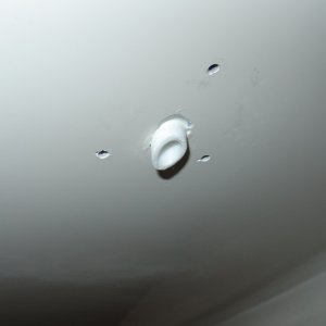 Drain tube cut at angle and a little longer so that dirty water from anchor locker does not stain hull.