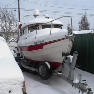 April snow covers the boat.