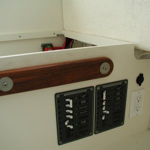 Separate 110v. panels for shore power only loads and inverter pass through loads.