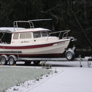 Frosty morning yesterday. New shore power, windlass, and the new artwork showing.