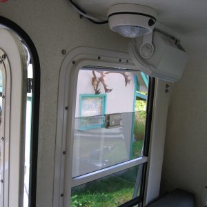 Speaker swiveled aft out window