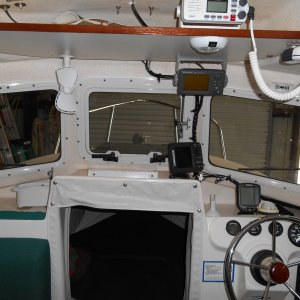 Generally cleaned up wiring runs in the cabin and helm area. Added fans, LED lamps, 12v plugs, reading lamps above berth, etc. Added charger under galley and invertor next to helm.  Rewired the whole electrical panel.