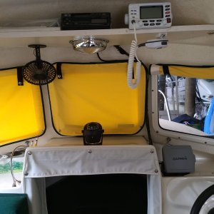 01 before - helm shelf with VHF, stereo and bus bar in the middle right behind the stereo