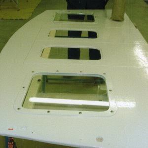 June 2005:  Glass & painted frames being installed on upper bulkhead.