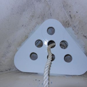 Media 'Shelf sits on cleats.  It has been thoroughly epoxy coated, then painted. Has holes for drainage.  Bitter end of rode tied off below.' in album 'Epoxied cleats to side of bow to hold shelf'