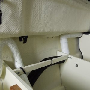 overboard exhaust and forward air return, return goes up to front of V-birth.