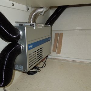 Mounted under forward passenger seat.
Coax exhaust /combustion line is only warm to the touch.