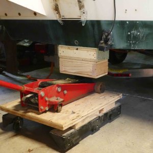 Here the floor jack is being used with the extension for lifting the stern.