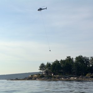 Helicopter transporting cement from Gabriola to Entrance Island