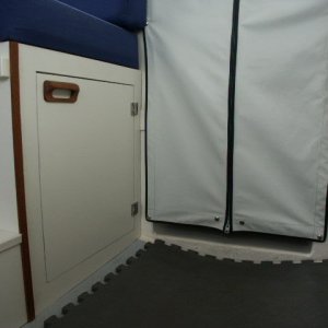 Cut door into front port storage area. Easier and faster access.