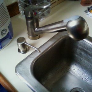 new pull-out faucet and soap dispenser for less wasted water and puddles on the counter