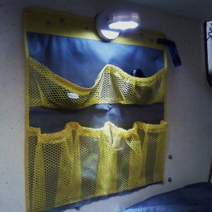 pockets, light, and extinguisher added to V-berth on port side