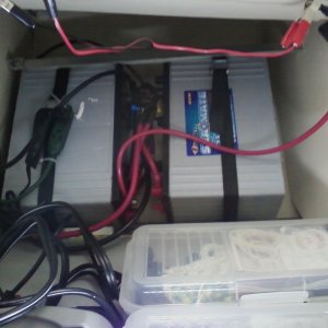Yes those are two AGM group 31 batteries on edge under the co-pilot seat and no they don't cause a list.

25s are heavy