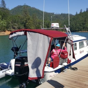 Dana and Sierra on shakedown cruise on lake Shasta, she designed the bimini full enclosure to have either sun/bug screens for Mexico or clear plastic for up north.