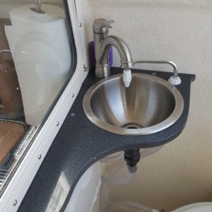 I added a sink, pressure and raw water in the head. We also removed the salt water head and instaled the airhead composting head from our previous Ranger Tug 25sc,we think it is less hassle than dealing with a holding tank. It has a constant on muffin fan so there is less odour than a standard head. We added 2 group 31 batteries and a large solar system so the tiny amp draw is not a problem.