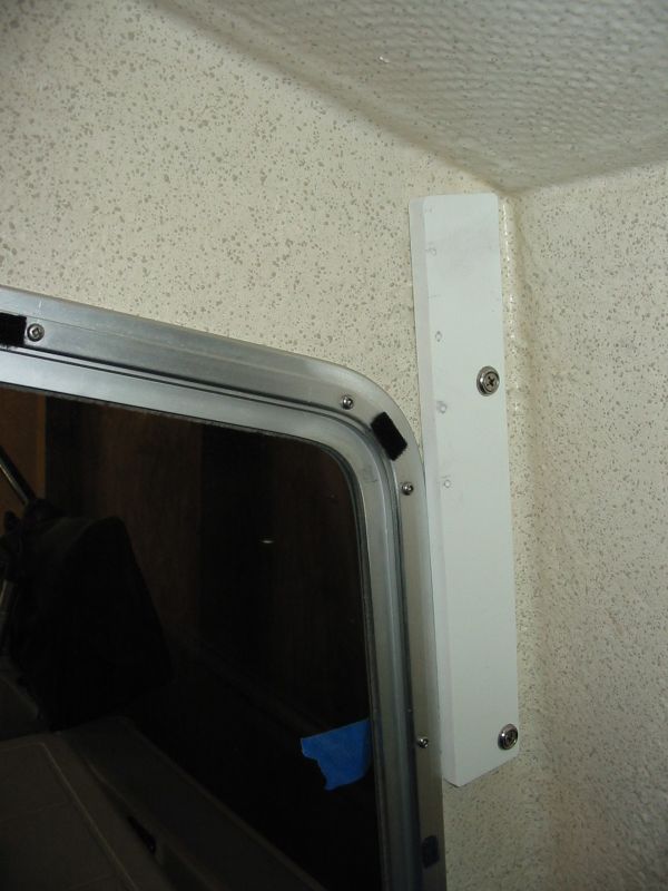 1/2" Seaboard(Tap Plastics)abuts window frame and allows speaker bracket to be scooted over to clear wall. No holes and speakers rotate over 90 degrees
